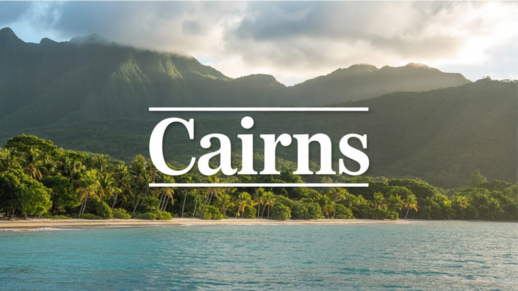 Cairns travel guide featuring coastline, Coral Sea, and rainforest mountains in North Queensland