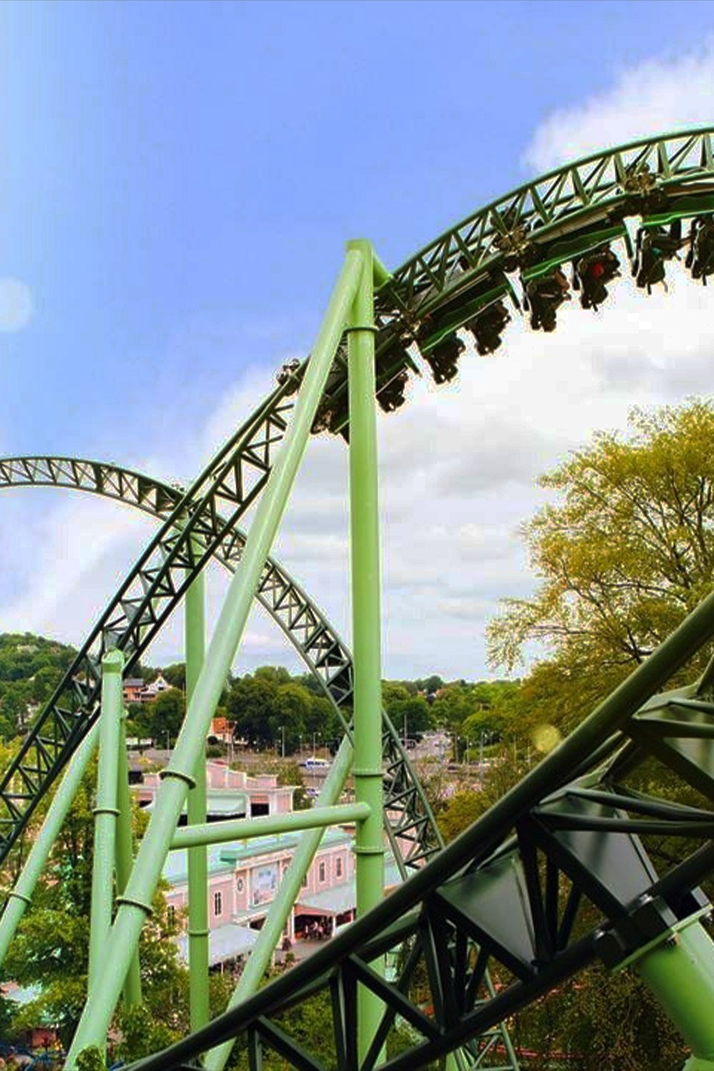 Helix roller coaster at Liseberg amusement park in Gothenburg Sweden with loops and scenic skyline views
