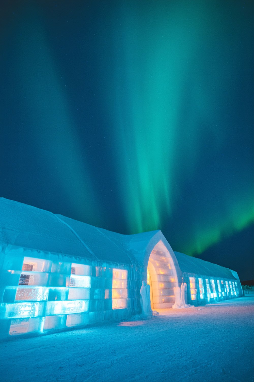 Sweden Ice Hotel in Jukkasjärvi during winter travel with glowing blue ice interiors