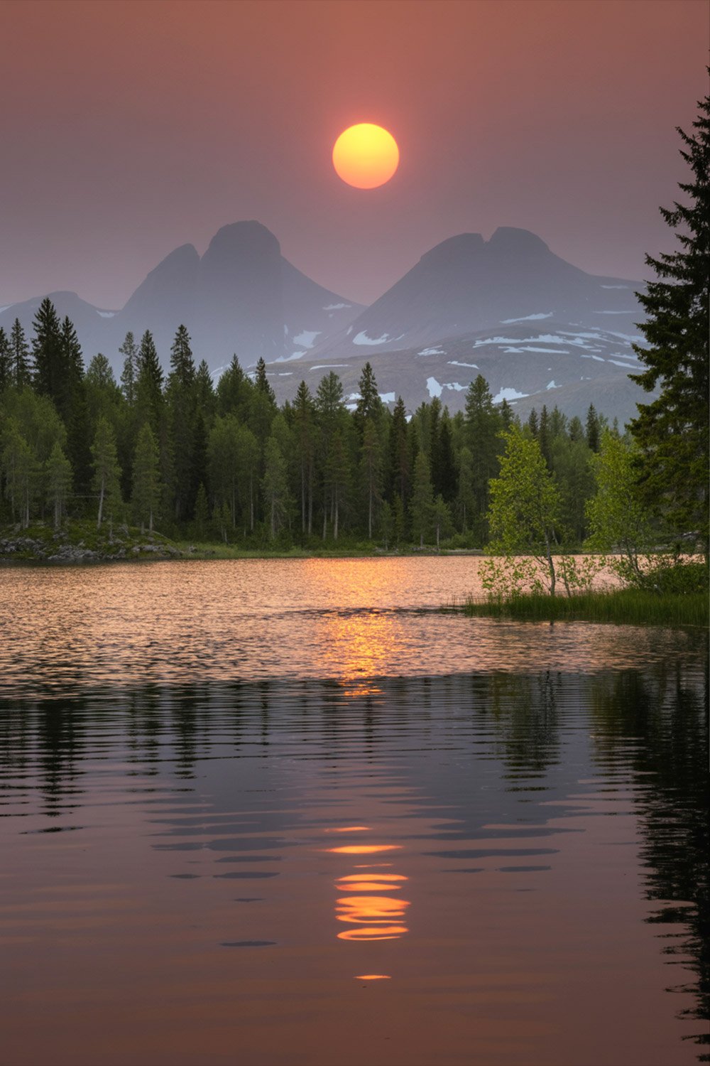 Midnight sun over Sweden’s Arctic summer landscape with glowing skies and rugged wilderness – Pathfinders Travel