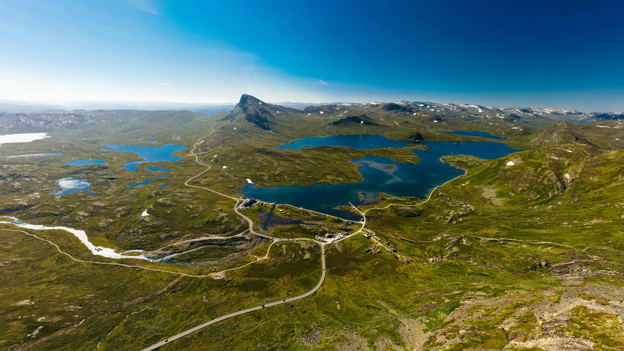 Hiking trail in Jotunheimen National Park with snow-capped peaks in Norway