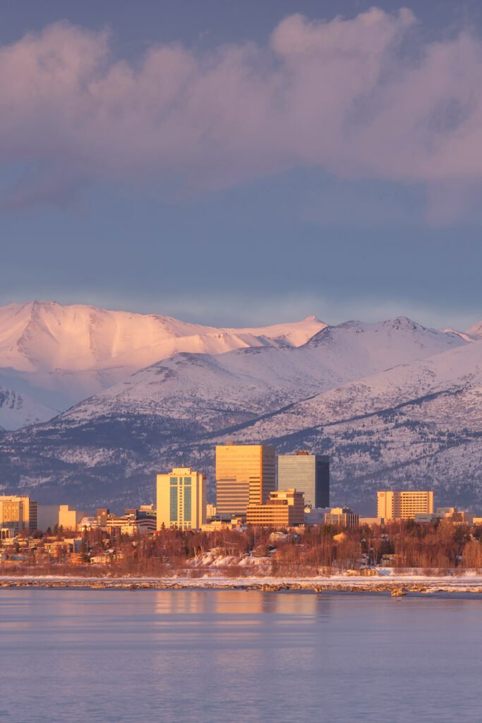 Anchorage Alaska travel itinerary 2026 with skyline, mountains, and Tony Knowles Coastal Trail