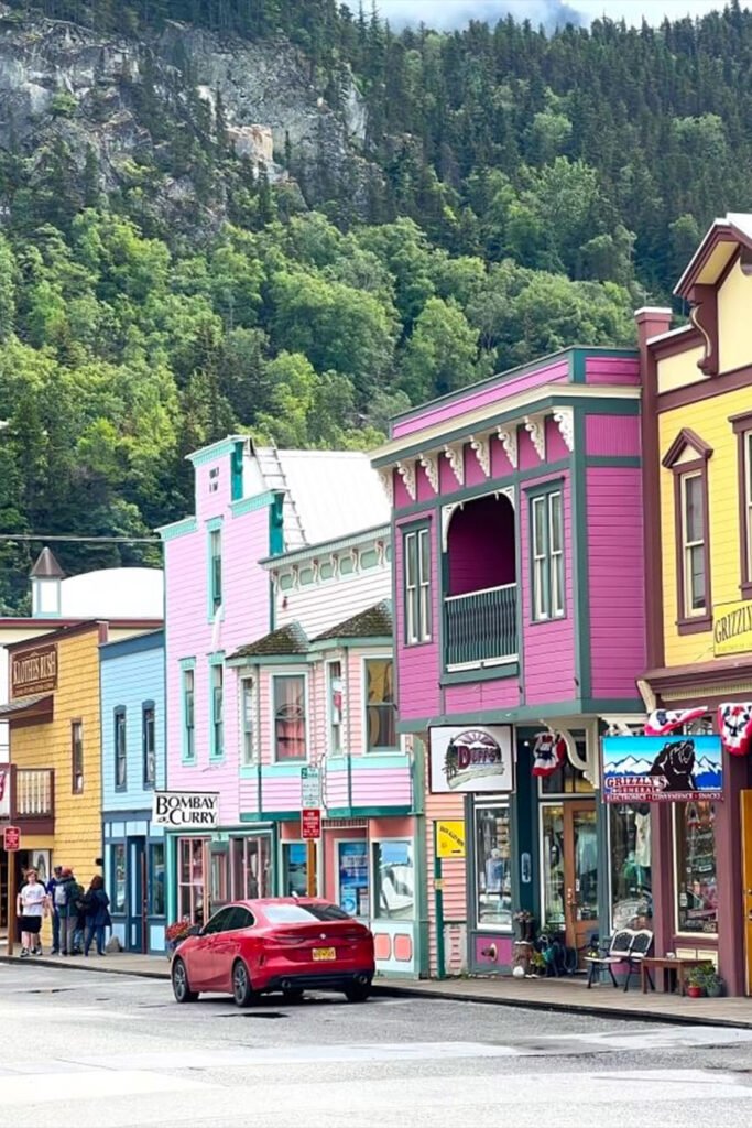 Skagway Alaska travel guide 2026 showing historic Gold Rush town with mountains and scenic railroad, featured in Pathfinders Travel blog