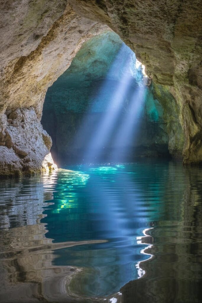 The Grotto Sea Cave in Bruce Peninsula National Park with turquoise waters and limestone cliffs, a top Tobermory hiking destination featured by Pathfinders Travel.