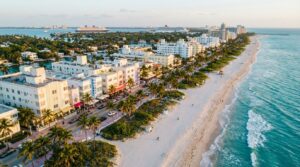 Aerial view of Miami Beach Art Deco district and turquoise coastline at sunset
