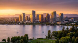 Bellevue Washington skyline at sunset with Lake Washington and Cascade Mountains