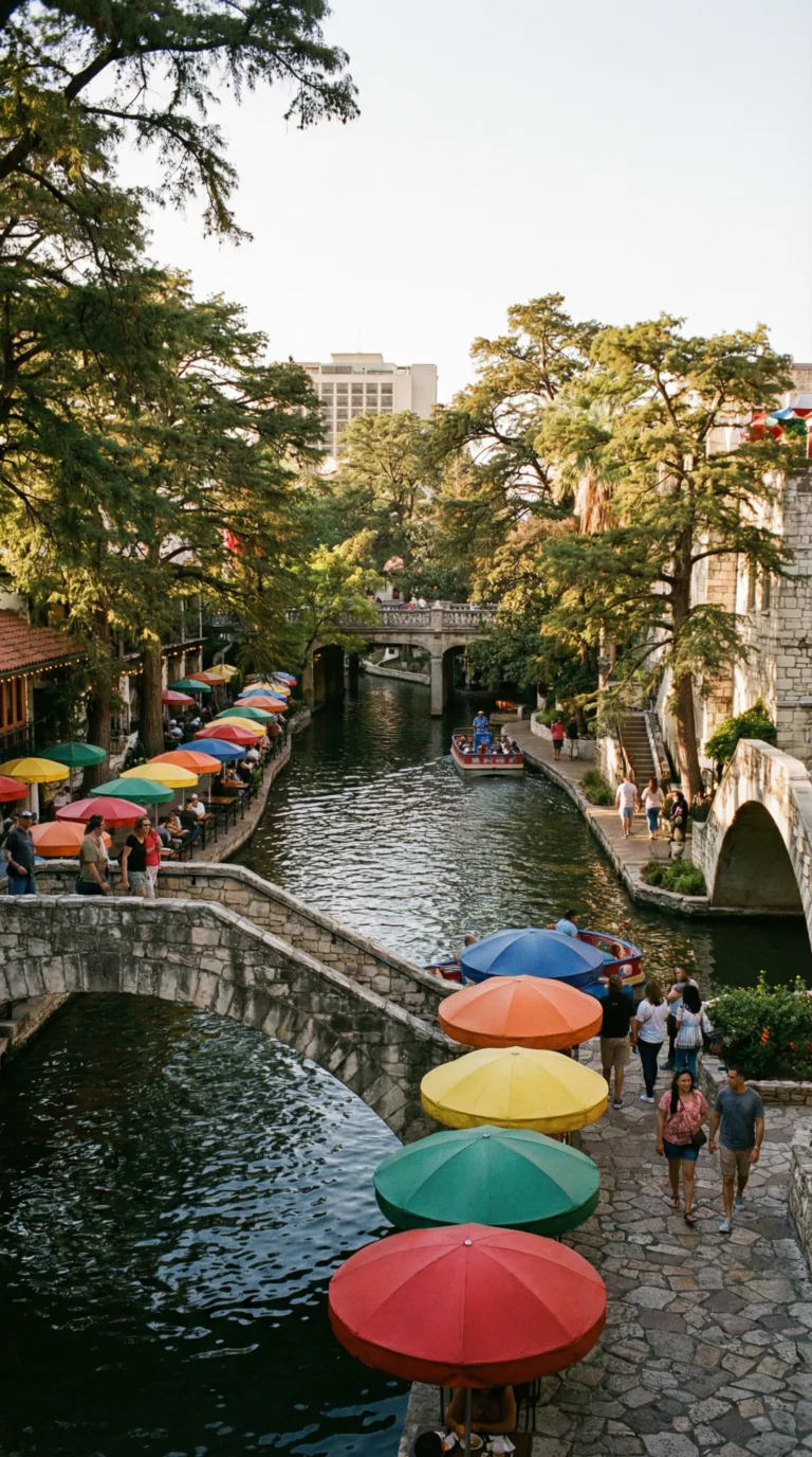 San Antonio River Walk with colorful umbrellas and historic bridges
