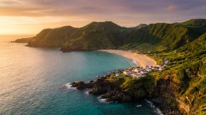 Aerial view of Praia Formosa golden beach and turquoise bay on Santa Maria Island, Azores