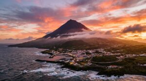 Mount Pico volcano rising above the Atlantic Ocean in the Azores at sunset